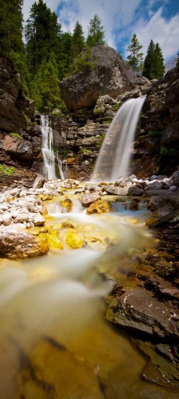 Serene Waterfall in Lush Mountain Forest