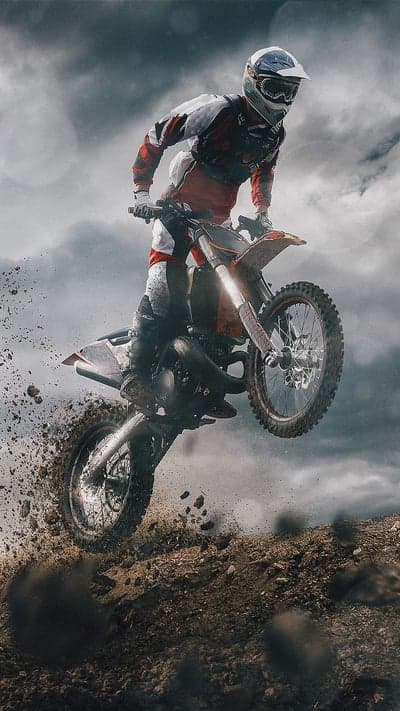 Motocross Rider Jumps Dirt Bike Mid-Air