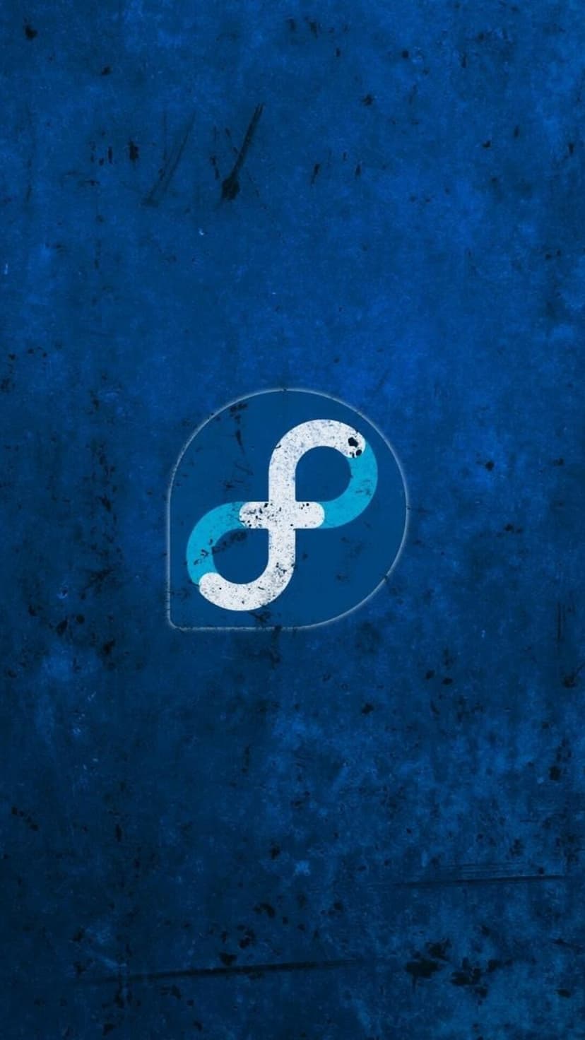 Fedora Linux logo with a cyan infinity symbol on a scratched navy blue background for smartphone screen displays.