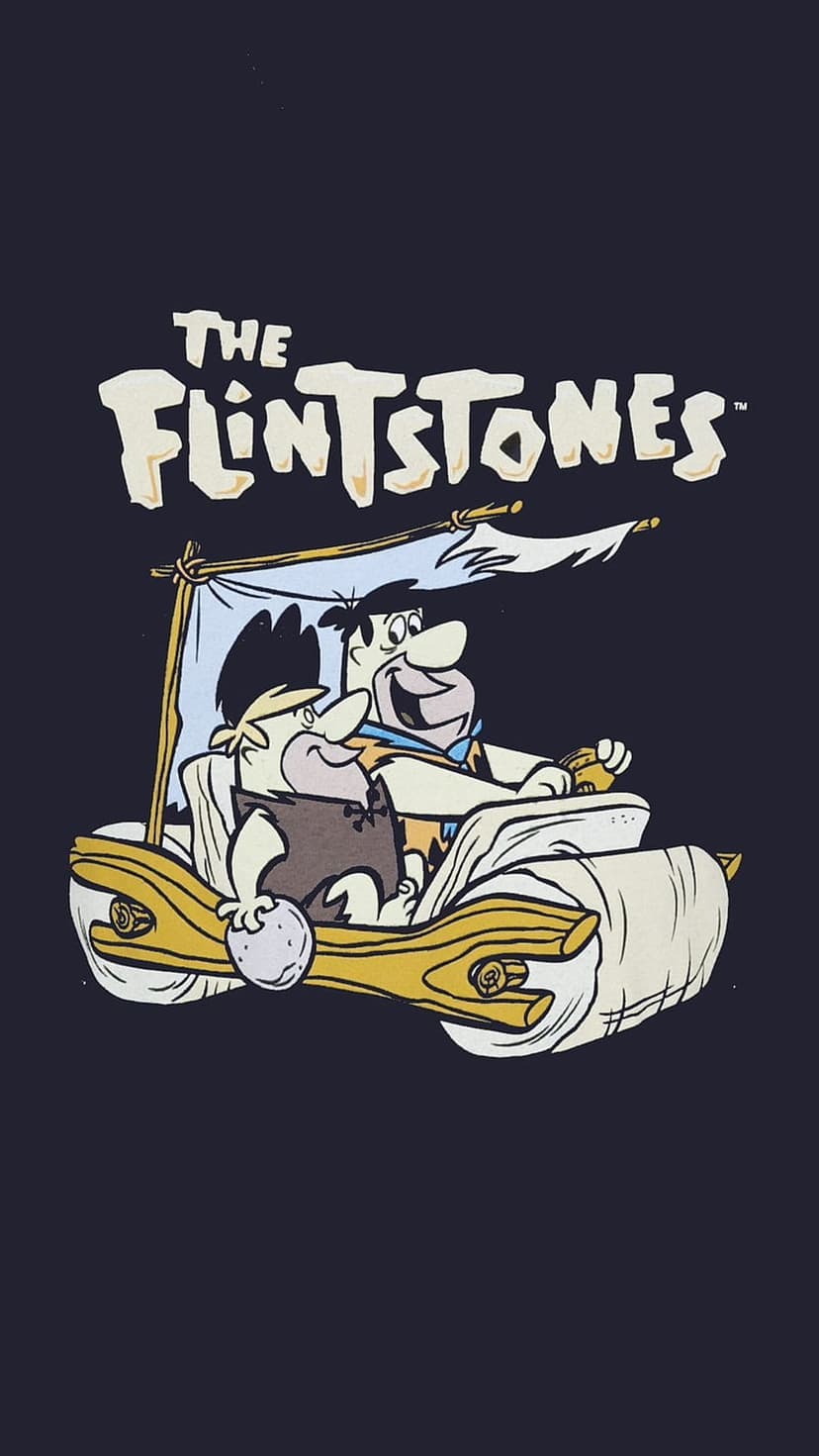 Fred Flintstone and Barney Rubble drive their rock car with a large series logo displayed above in Bedrock.