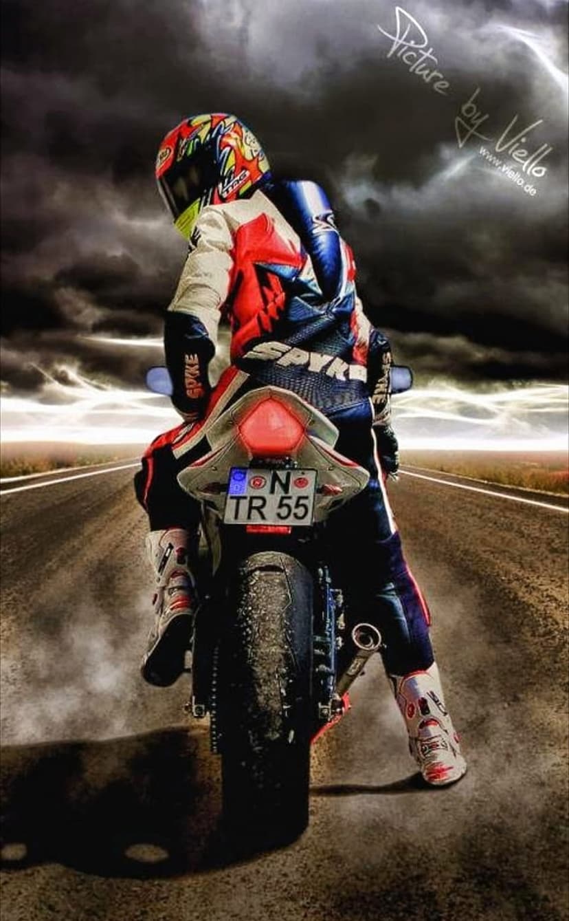 Motorcyclist in a colorful racing suit rides a sportbike with a glowing taillight under dark storm clouds.