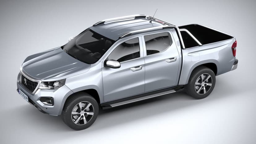 Silver double cab pickup truck with chrome roof rails and black wheels on a light grey studio background.