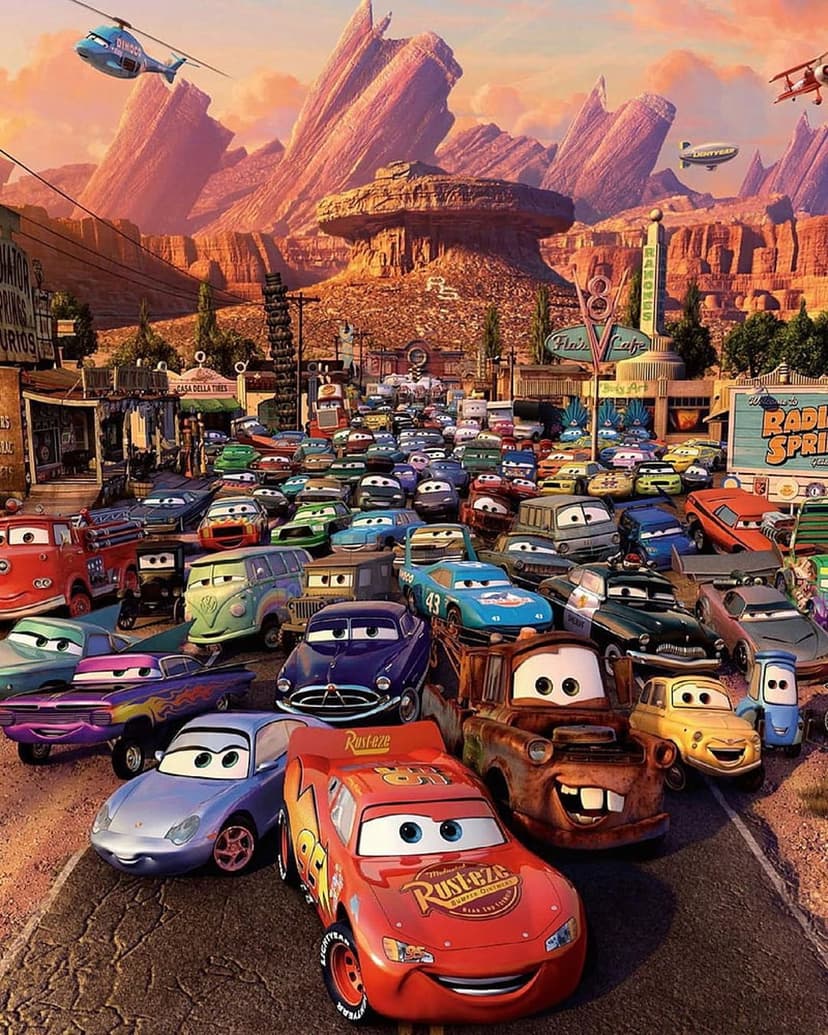 Lightning McQueen and Mater parked on a desert town street with a helicopter flying over Radiator Springs.