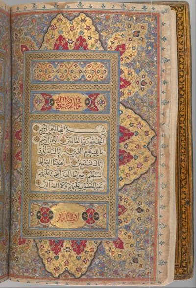 Ornate Quran page with gold illumination and Arabic calligraphy