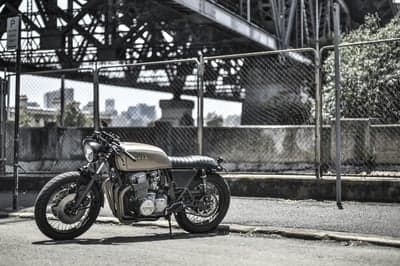 Retro Cafe Racer Under Industrial Bridge Phone Wallpaper