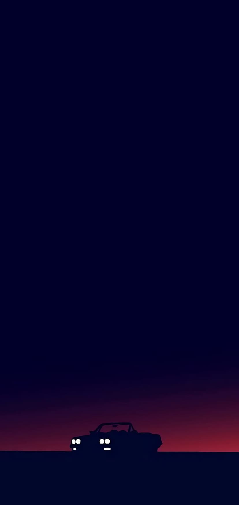 Vintage convertible car silhouette with glowing headlights against a deep purple and red twilight horizon.