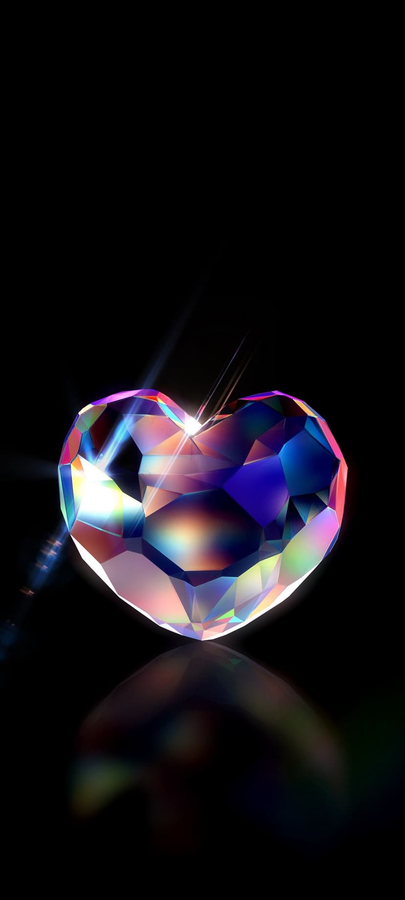Heart-shaped diamond on a black surface refracting sharp beams of rainbow light with a clear mirrored reflection.