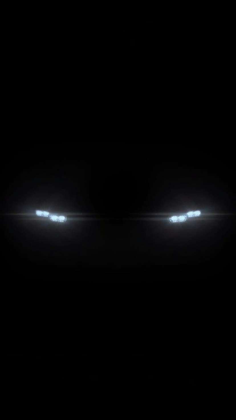 Two distinct clusters of glowing blue orbs and subtle lens flares float centered within a deep black void.