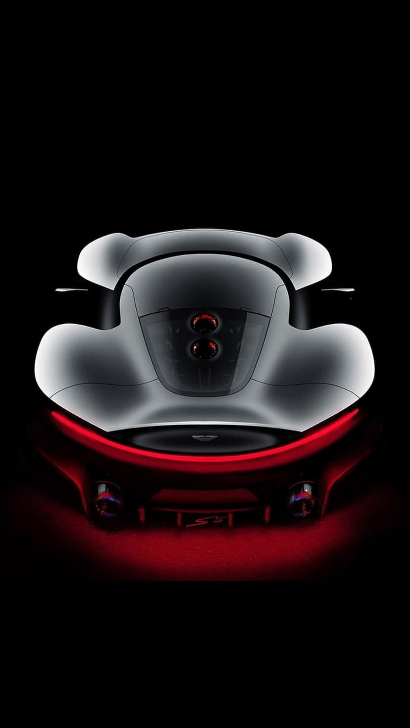 McLaren P1 rear fascia features thin red light bars and a carbon fiber diffuser against a dark backdrop.