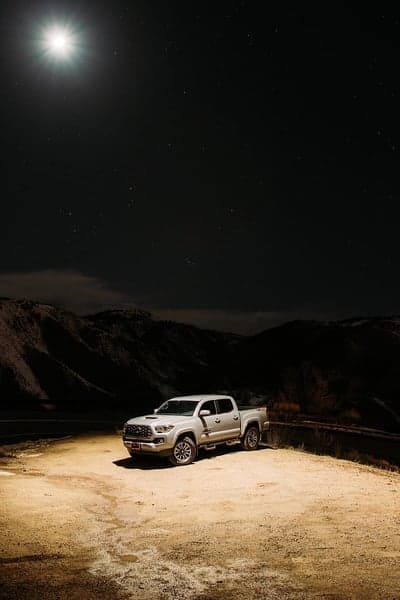 Rugged Tacoma Truck Under Celestial Night Sky Wallpaper
