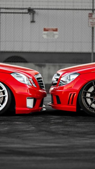 Two Red Mercedes-Benz Cars Front View