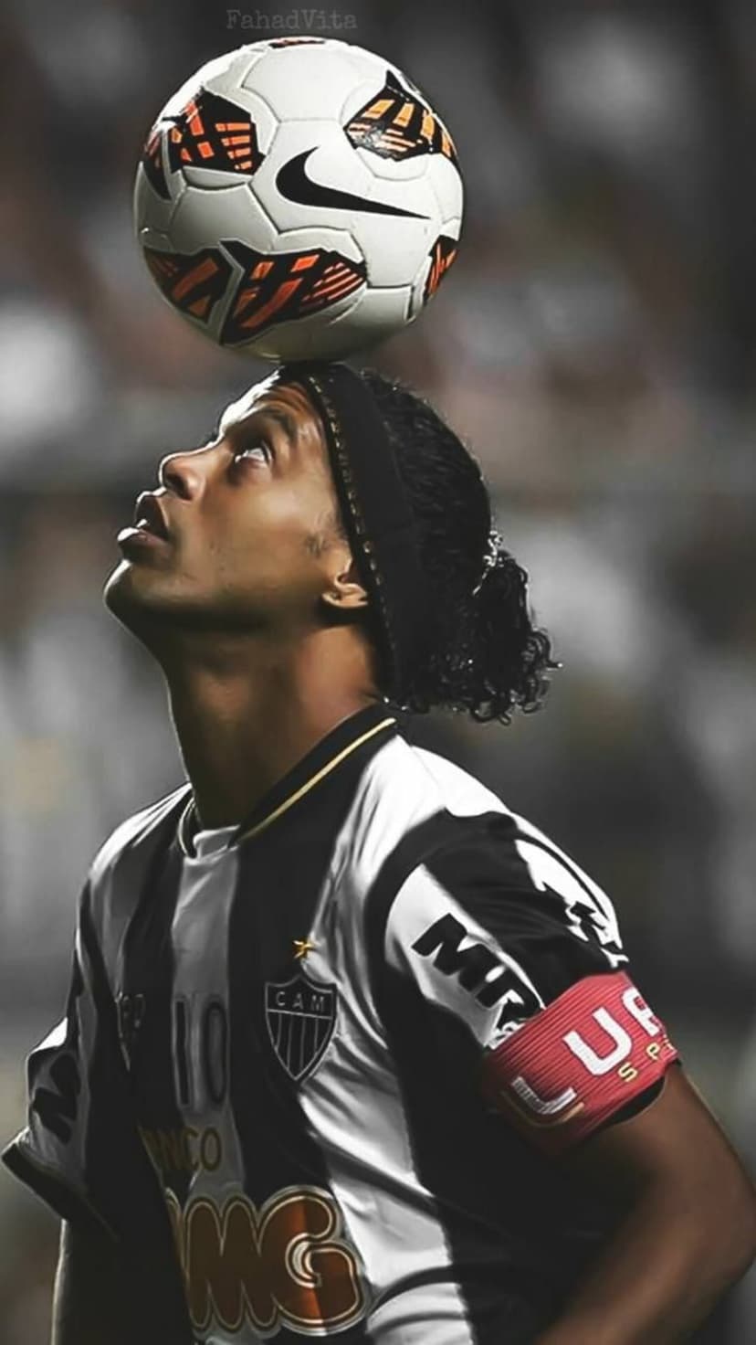 Ronaldinho balances a soccer ball on his forehead while wearing a striped number ten jersey and a red armband.