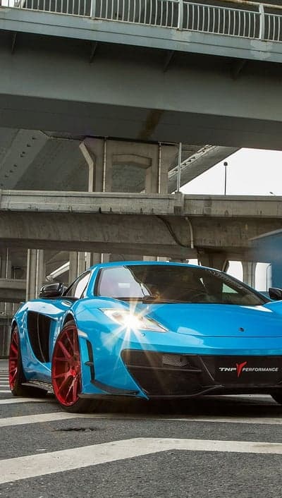Blue McLaren Supercar Mobile Wallpaper with Red Wheels