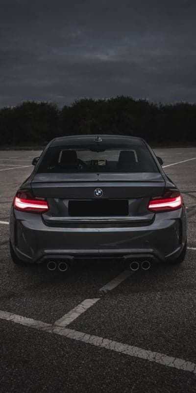 Dark BMW M2 Coupe with Glowing Taillights