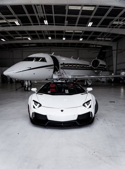 White Lamborghini Aventador and Private Jet in Hangar