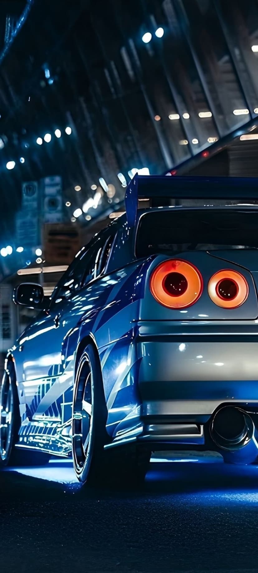 Blue sports car with a large spoiler and round taillights parked on a dark road in a glowing neon city at night.