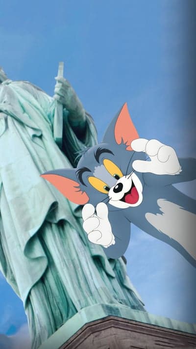 Tom the Cat Poses in Front of Statue of Liberty
