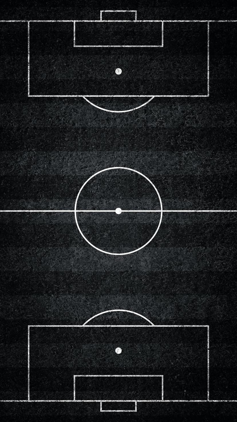 Soccer ball sits near the center circle of a dark textured football field with sharp white chalk lines.