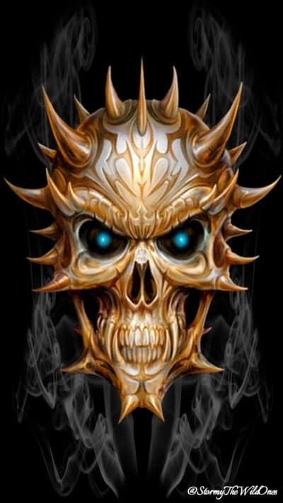 Gilded Horned Demon Skull with Radiant Blue Gaze Wallpaper
