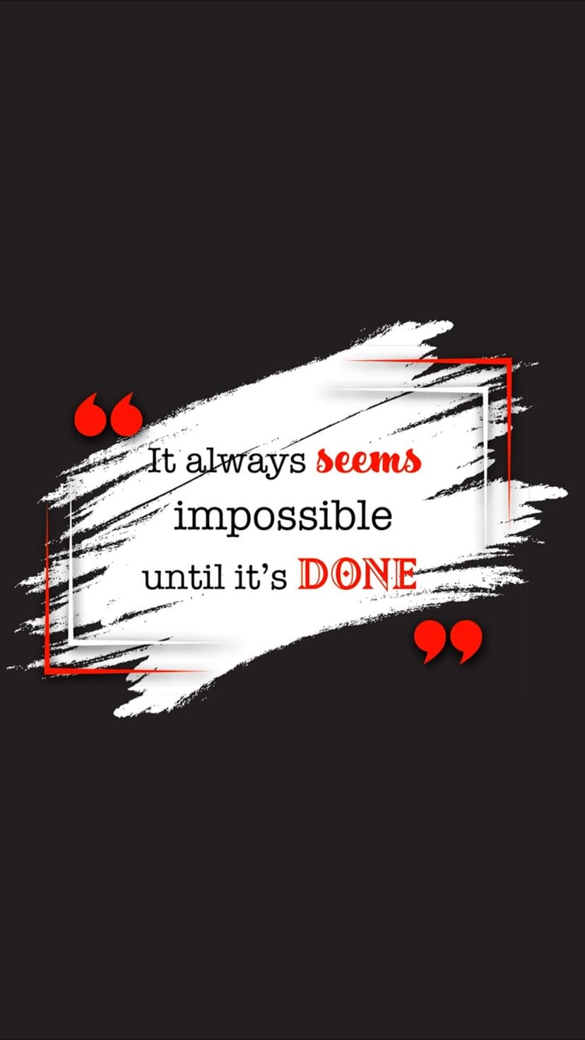 Motivational typography with a red accent sits atop a white paint stroke against a black textured surface.