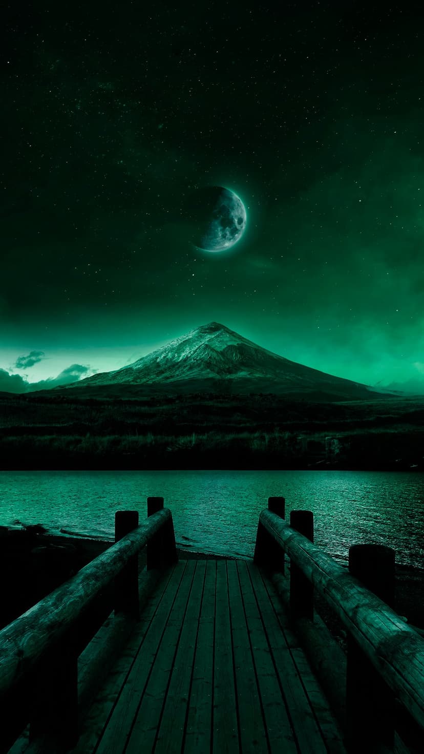 Wooden pier leads to a snowy mountain peak under a large cratered moon and starry sky in a dark teal landscape.