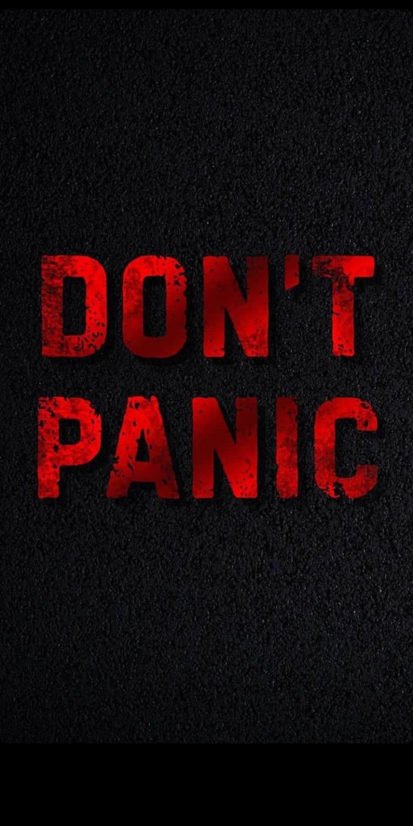 Red distressed text spelling Don't Panic centered on a dark gritty and weathered black textured background.