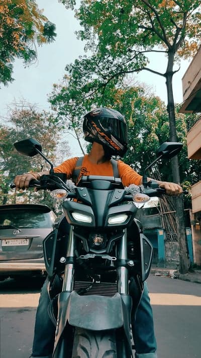 Orange Biker and Black Sport Motorcycle Phone Wallpaper