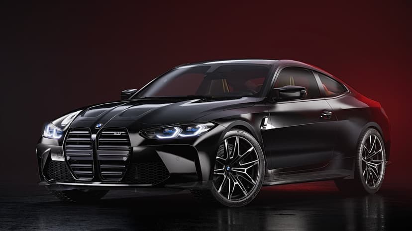 Black BMW M4 sports car with glowing blue headlights in a dark studio with a vibrant red background light.