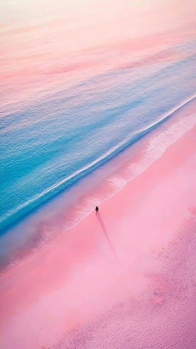 Ethereal Pink Sand Beach and Blue Ocean Phone Background