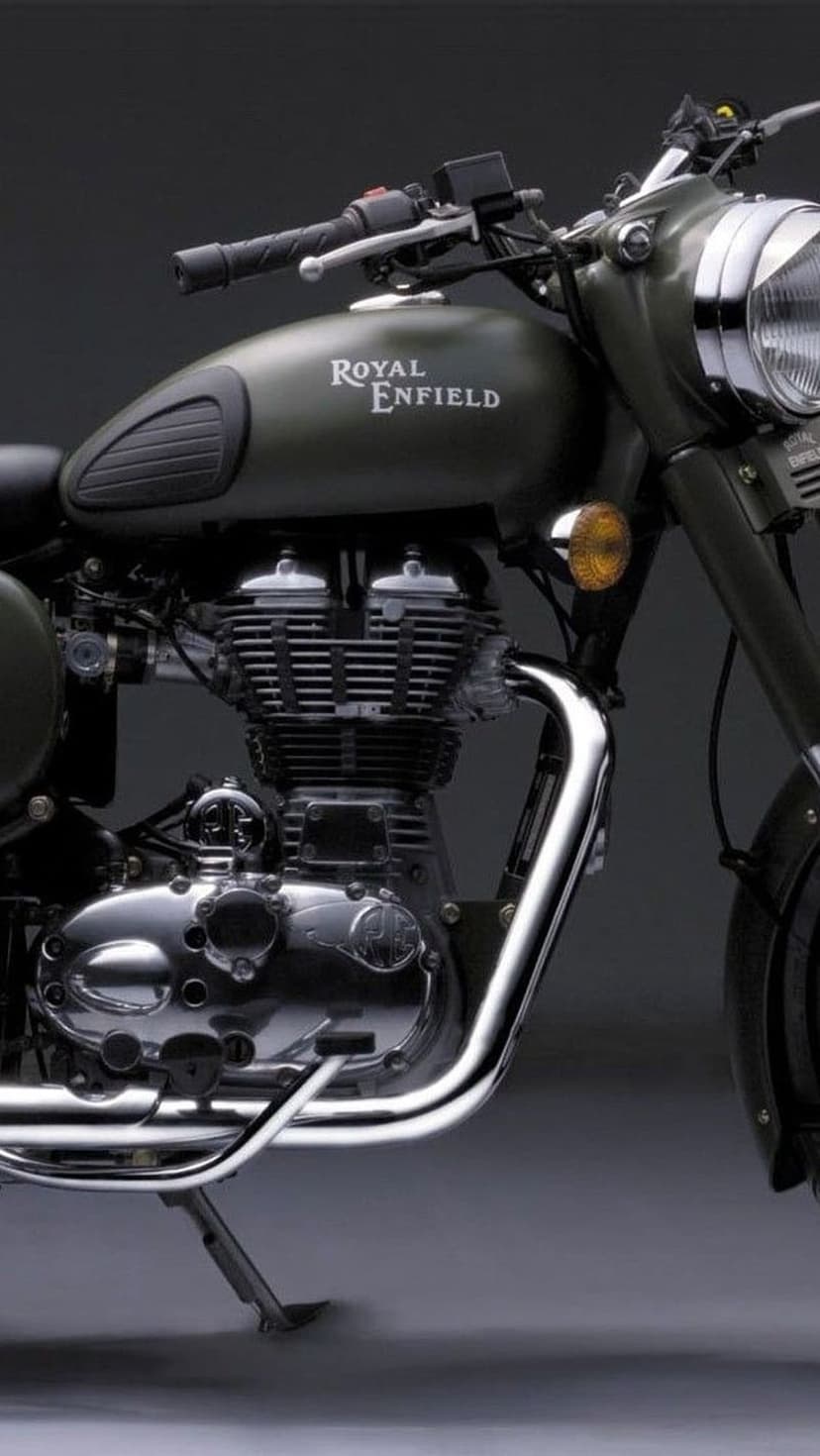 Royal Enfield motorcycle engine and matte green fuel tank with polished chrome parts and vintage branding.