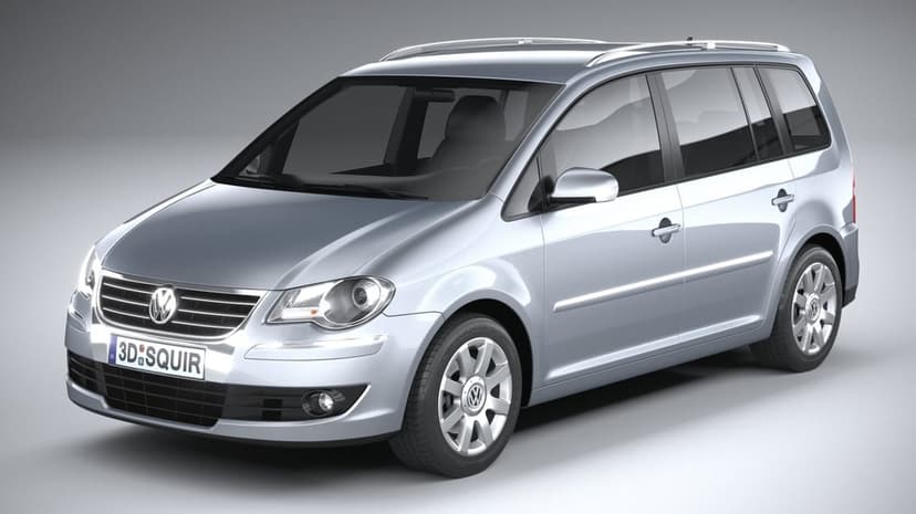 Silver Volkswagen Touran MPV in a studio setting with metallic paint, alloy wheels, and neutral grey background.