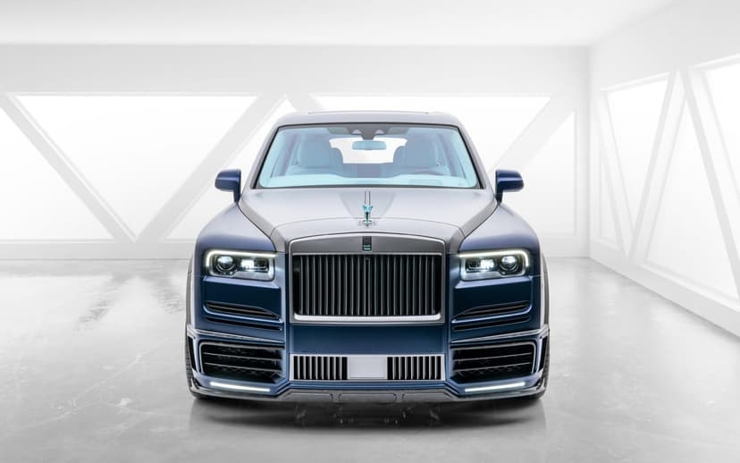 Mansory Rolls-Royce Cullinan SUV front view in a minimalist white studio with geometric lighting and blue accents.