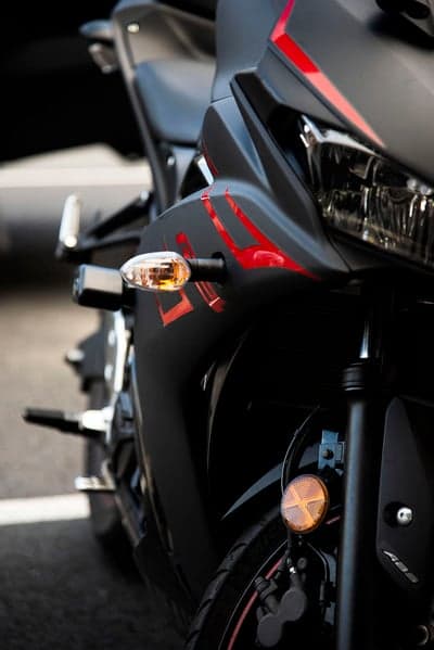 Close-up of a black motorcycle with red accents