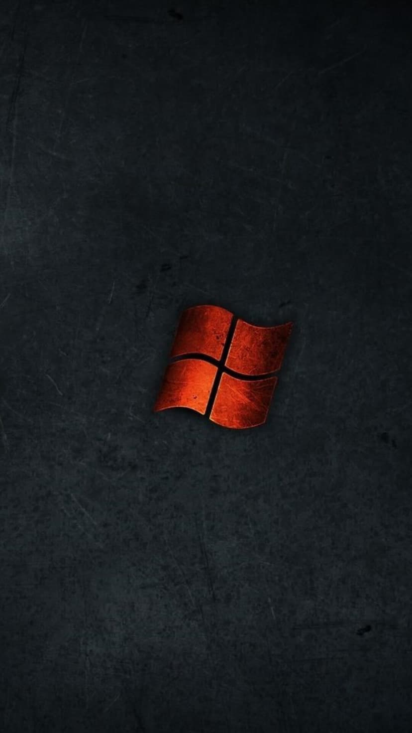 Red Windows logo centered on a dark grey background with fine scratches and a weathered industrial texture.