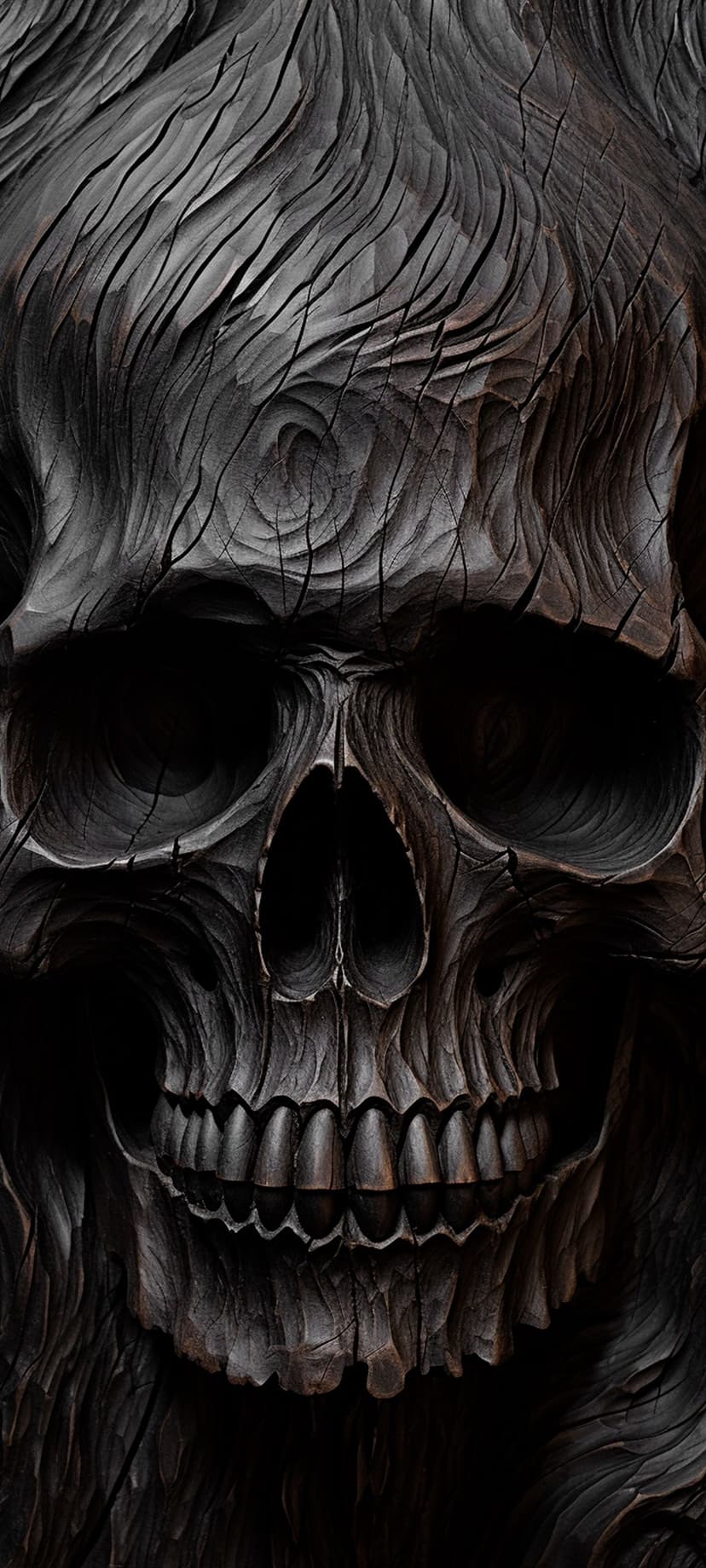 Wood-textured skull carving features intricate grain patterns and dark charcoal shadows in a close-up view.