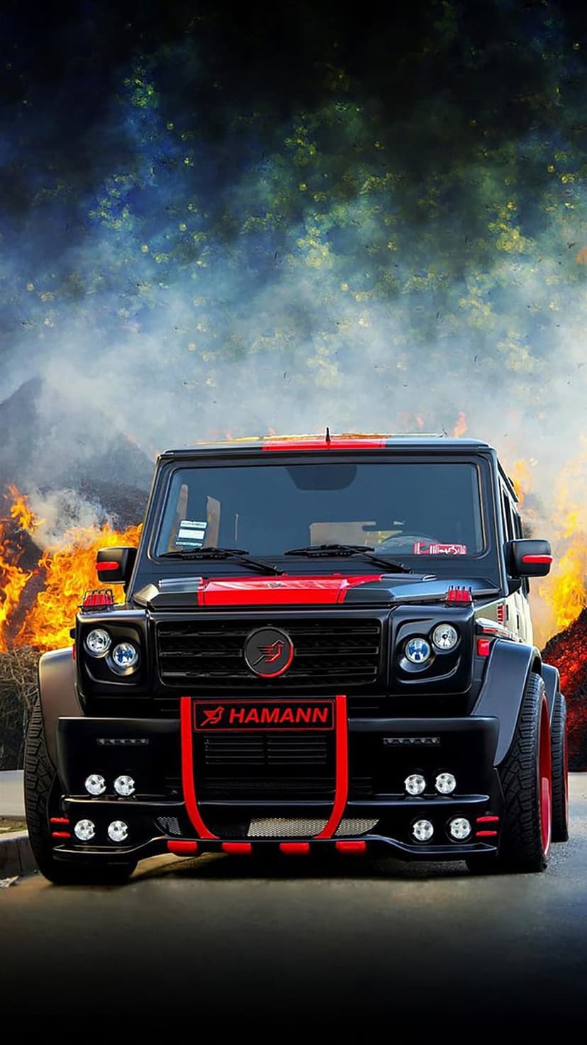 Black Hamann G-Wagon SUV with red accents surrounded by raging orange fire and thick dark smoke clouds.