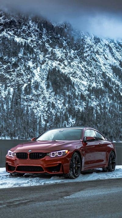 Red BMW M4 Coupe Snow Mountain Phone Background