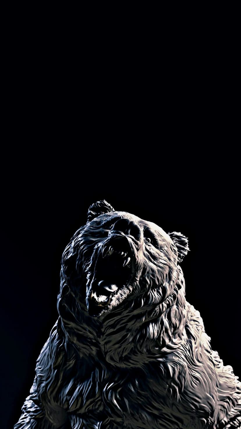 Roaring bear sculpture with detailed fur and open mouth illuminated by dramatic side lighting on a black background.