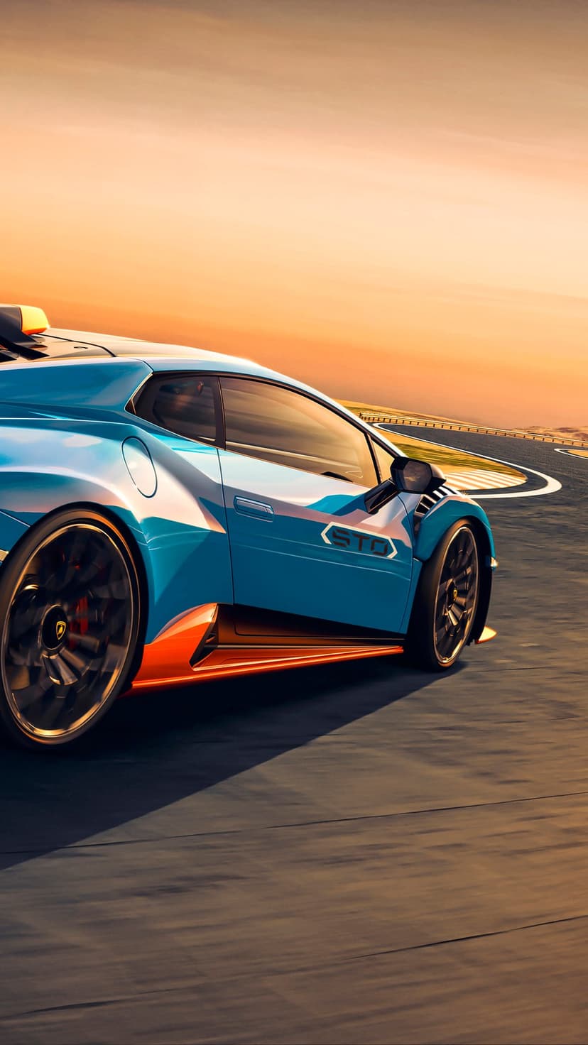 Blue Lamborghini Huracán STO with orange accents racing on a track under a vibrant golden sunset sky background.