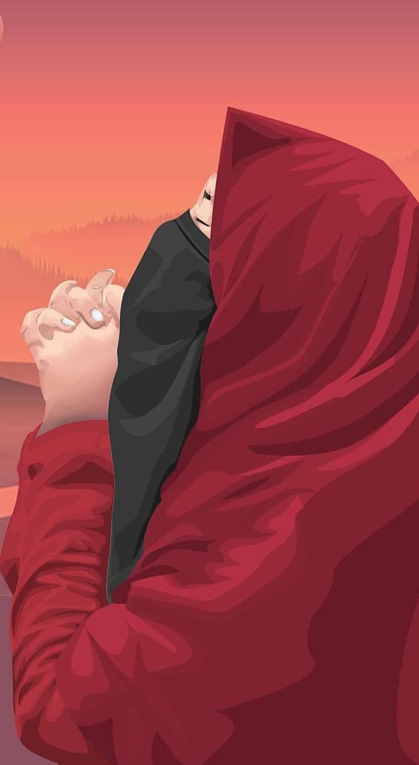 Couple in flowing red robes praying with joined hands against a mountain sunset with orange and pink clouds.
