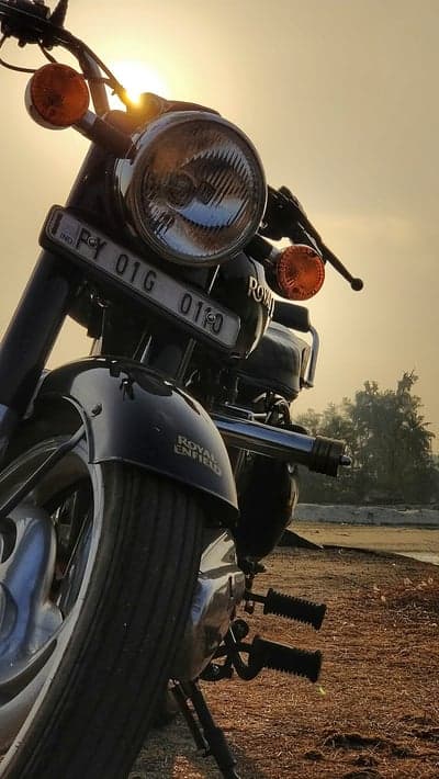 Vintage Royal Enfield Motorcycle at Golden Hour Sunset