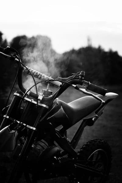 Black and white motorcycle with smoke rising