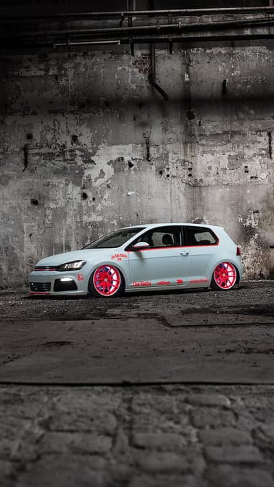 Custom White VW Golf GTI with Red Wheels