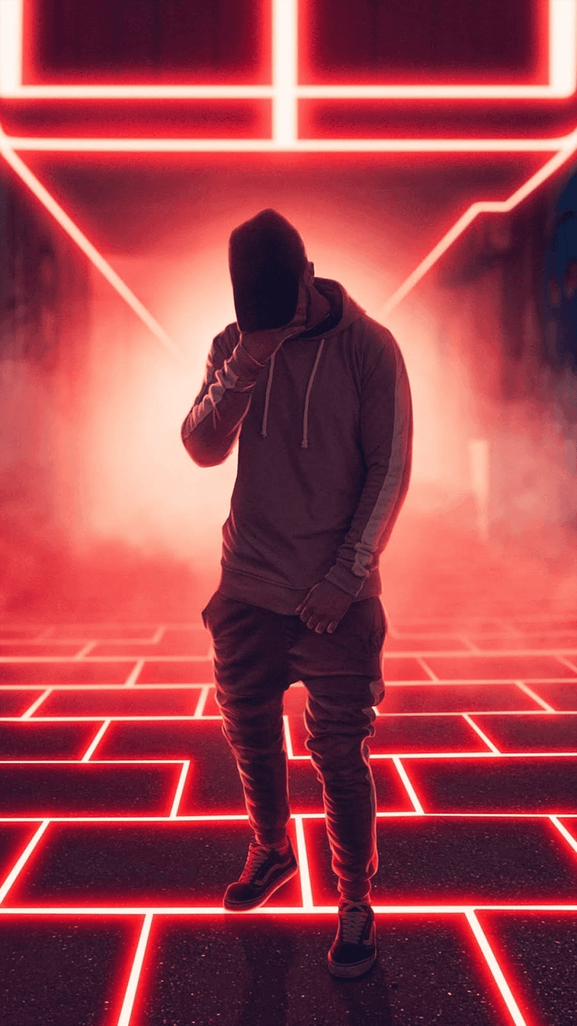 Hooded figure stands at the top of glowing red neon stairs in a dark, high-contrast futuristic hallway.