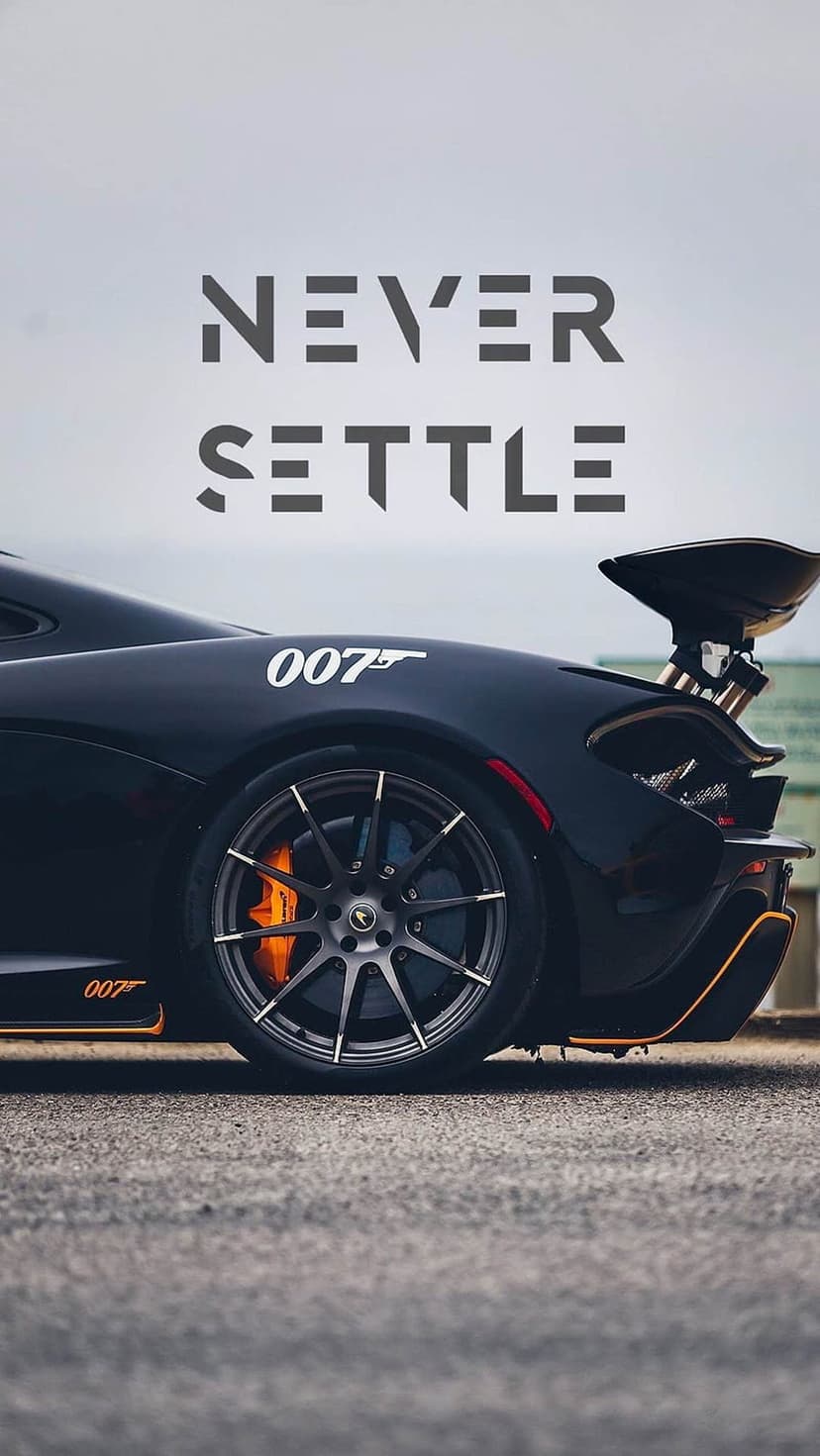Black McLaren P1 hypercar with 007 logo, orange brake calipers, and Never Settle text in a vertical orientation.