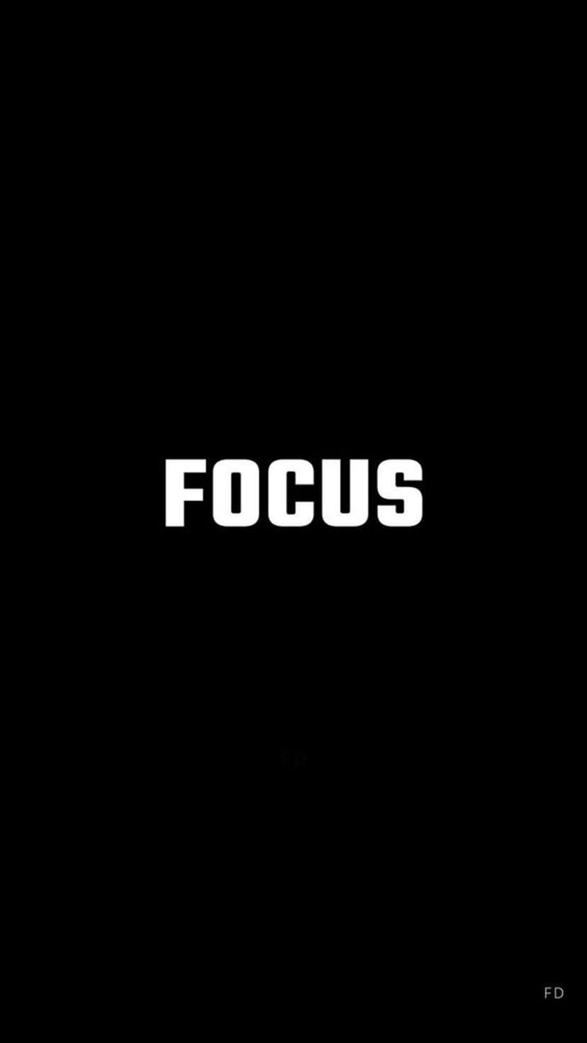Focus word in bold white capital letters centered on a solid black background for a minimalist mobile screen.