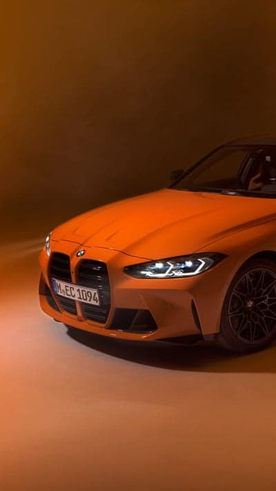 Vibrant Orange BMW M4 Sports Car Phone Background