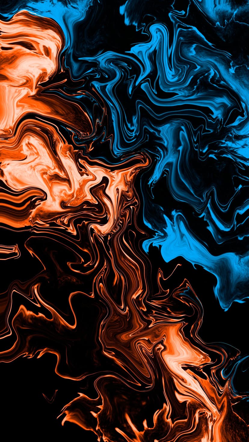 Swirling blue and orange liquid pigments marble together in high-contrast patterns against a black background.