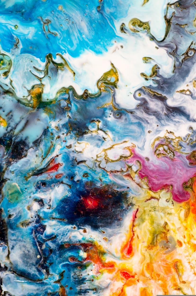 Gold metallic veins wind through swirling blue, purple, and red resin marbling in a vertical fluid art display.