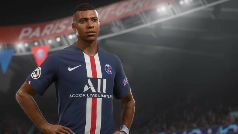 Kylian Mbappé in a navy PSG jersey stands in a stadium under bright lights with a blurred Paris banner behind him.